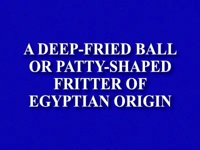 A jeopardy clue card which reads: "a deep-fried ball or patty-shaped fritter of Egyptian origin".